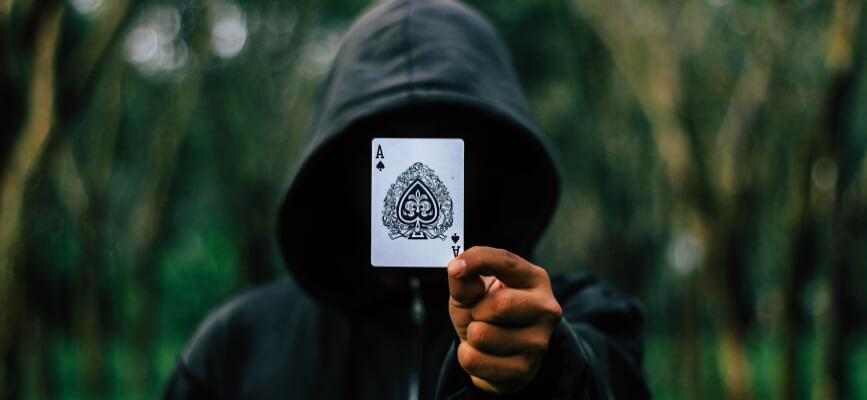 Man holding ace card